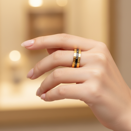 The "Special Date" multi-layered ring - a rotating design with gold and black stainless steel accents