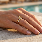 Double gold ring encrusted with crystals and adorned with a delicate butterfly