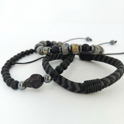 Men's three-piece bracelet set in black and gray with gold details