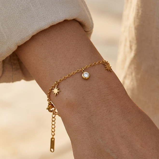 Gold-plated stainless steel bracelet with a star and crystal dangling design