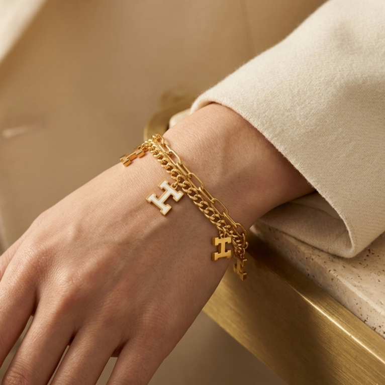 Gold-plated stainless steel bracelet with a two-layer design and H letter charms