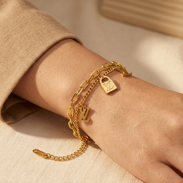 Gold-plated stainless steel bracelet with a two-layer design and elegant lock charms