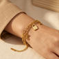 Gold-plated stainless steel bracelet with a two-layer design and elegant lock charms