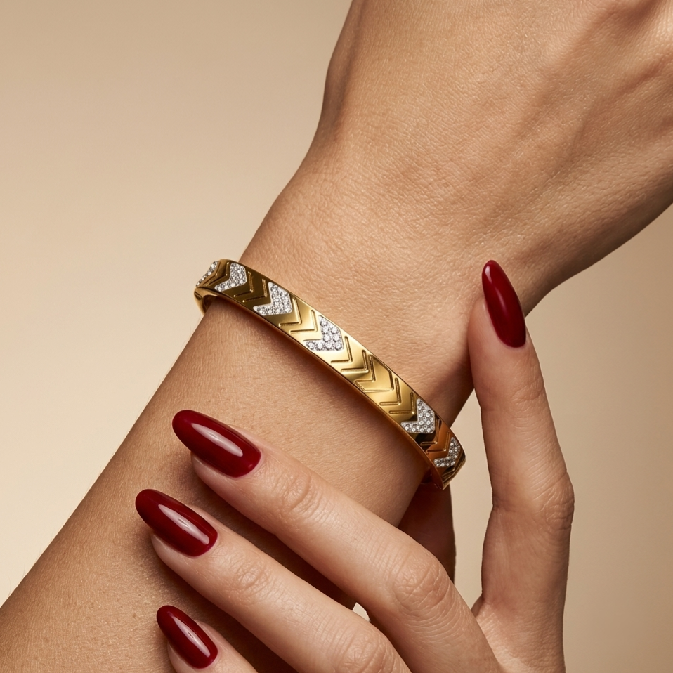 Stainless steel bracelet with a studded arrow design.