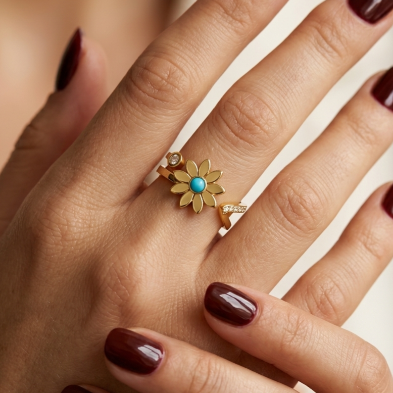 Stainless steel ring featuring a daisy flower, turquoise, and zircon.