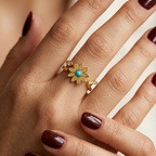 Stainless steel ring featuring a daisy flower, turquoise, and zircon.