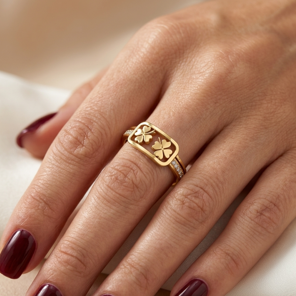 Open stainless steel ring featuring a clover leaf frame and zircon.
