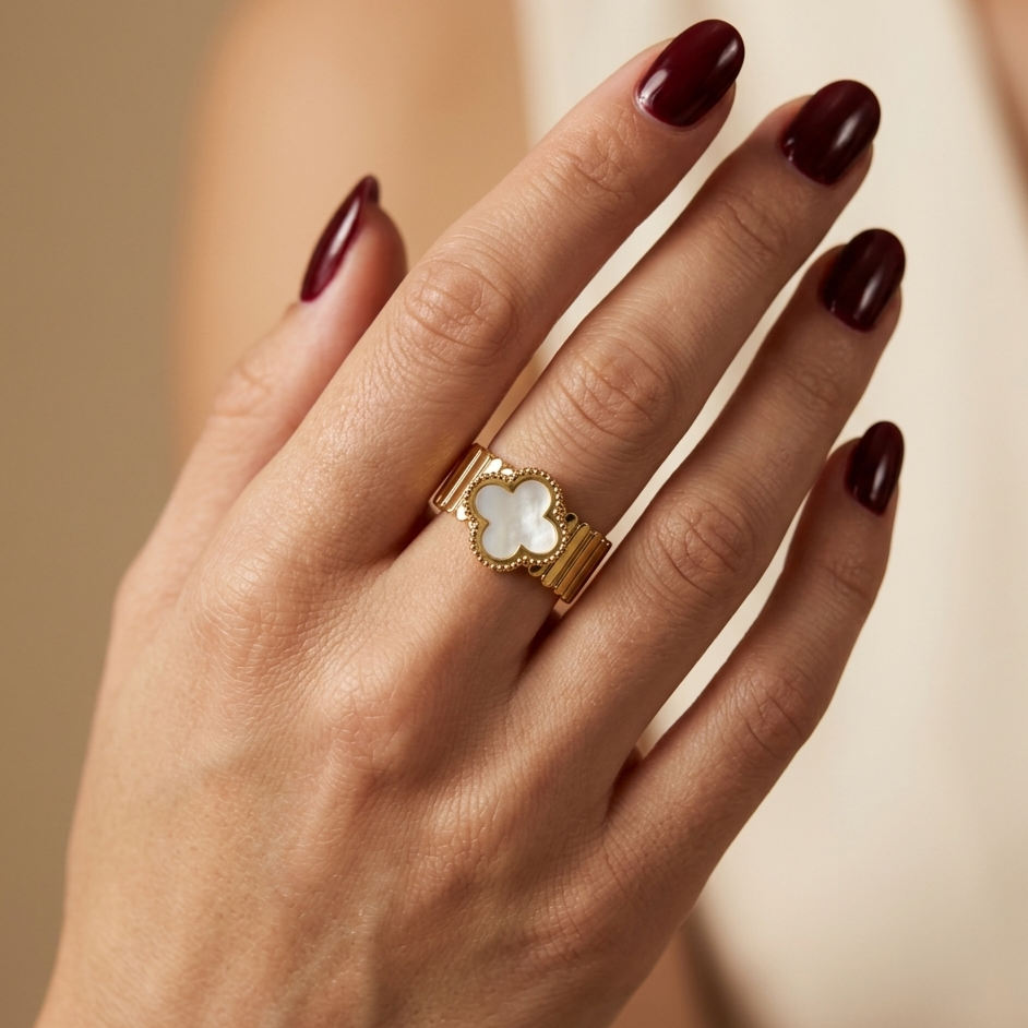 Open stainless steel ring with a wide mother-of-pearl flower