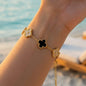 Stainless steel bracelet with black and sparkling quatrain flowers
