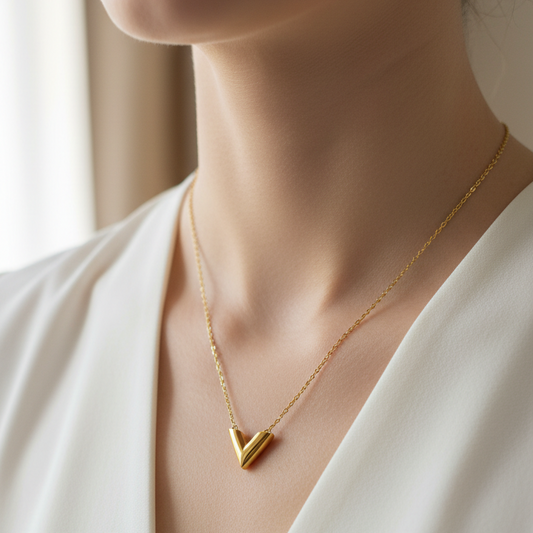 Stainless steel necklace with a gold "V" pendant - sleek and modern design