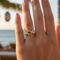 Infinity Cross Studded Ring – Gold-plated stainless steel ring with a cross design and crystal stones