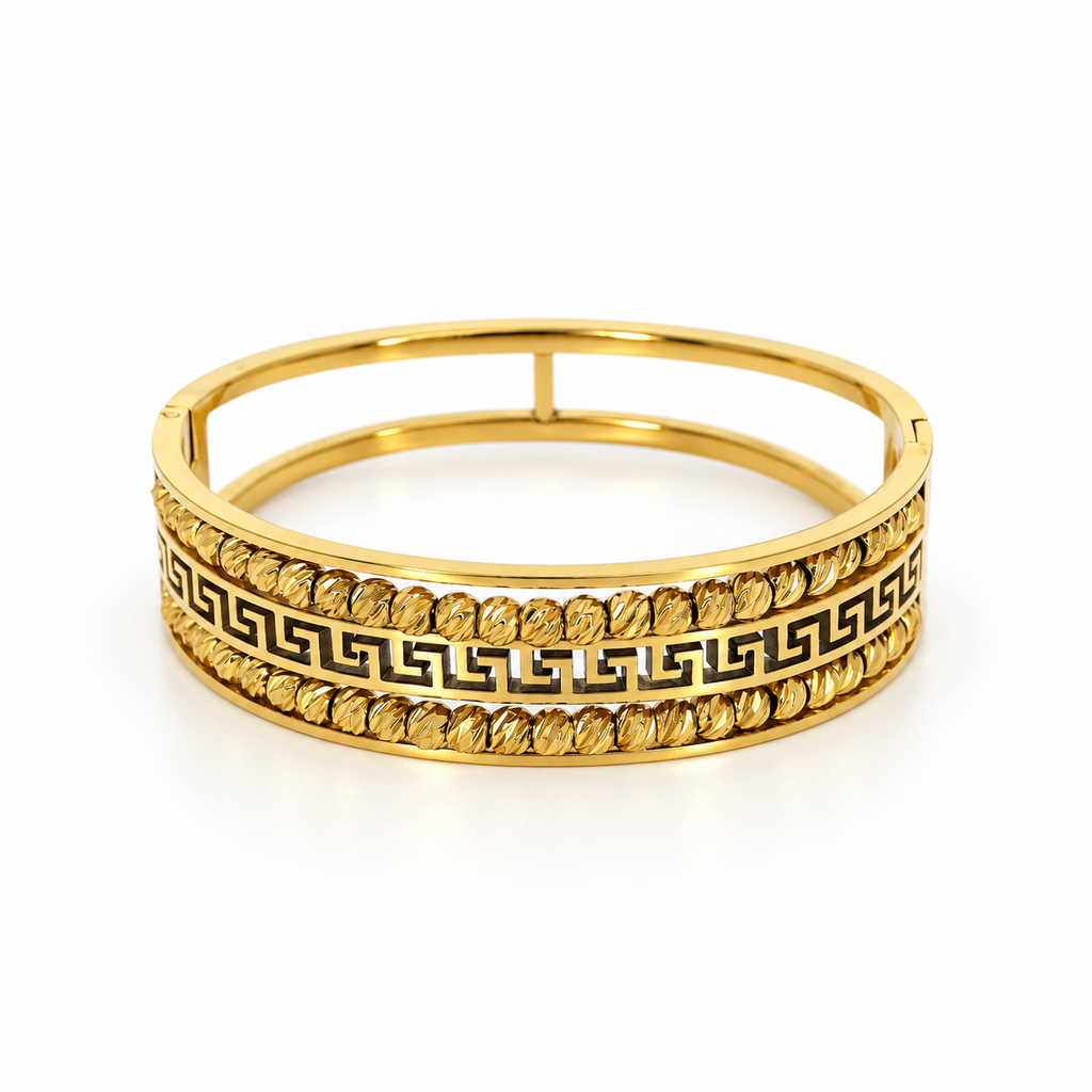 Stainless steel bracelet with Greek-style engraving and gold beads.