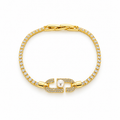 Stainless steel tennis bracelet featuring an embellished link and a pearl.