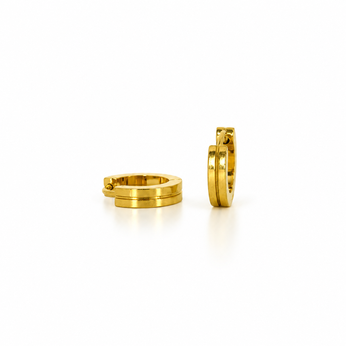 Small stainless steel hoop earrings with gold engraved lines.