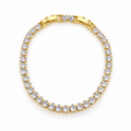 Gold-tone stainless steel tennis bracelet featuring heart-shaped zirconia stones.