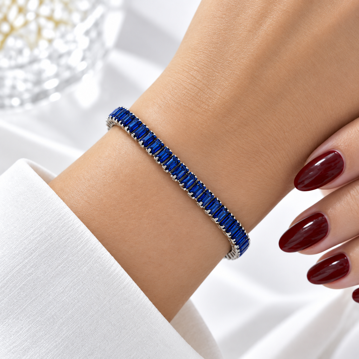 Silver stainless steel tennis bracelet set with royal blue zirconia.