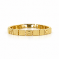 Gold stainless steel bracelet featuring a faceted cube design and screw engravings.