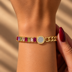 Two-tone stainless steel bracelet featuring a gold chain and multicolored zircon stones.