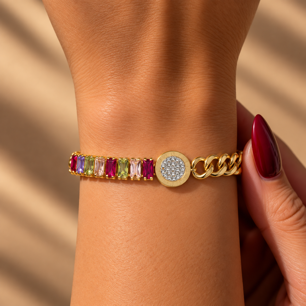 Two-tone stainless steel bracelet featuring a gold chain and multicolored zircon stones.