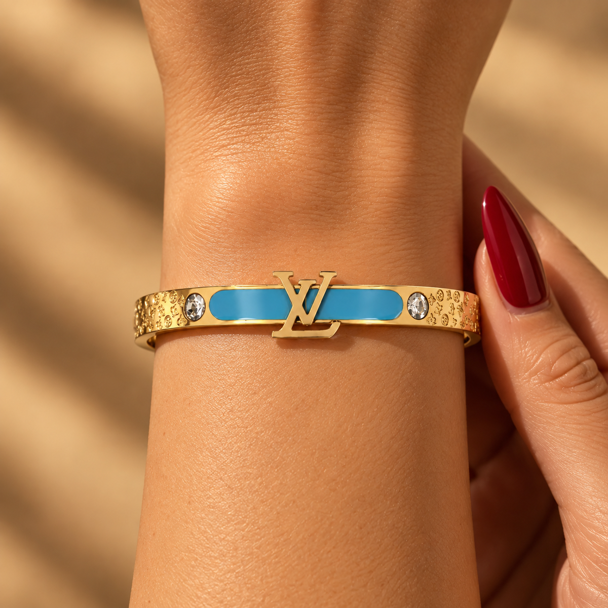 Stainless steel bracelet with gold letters and a sky-blue enamel strip.