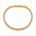 Gold-tone stainless steel tennis bracelet set with zircon stones.