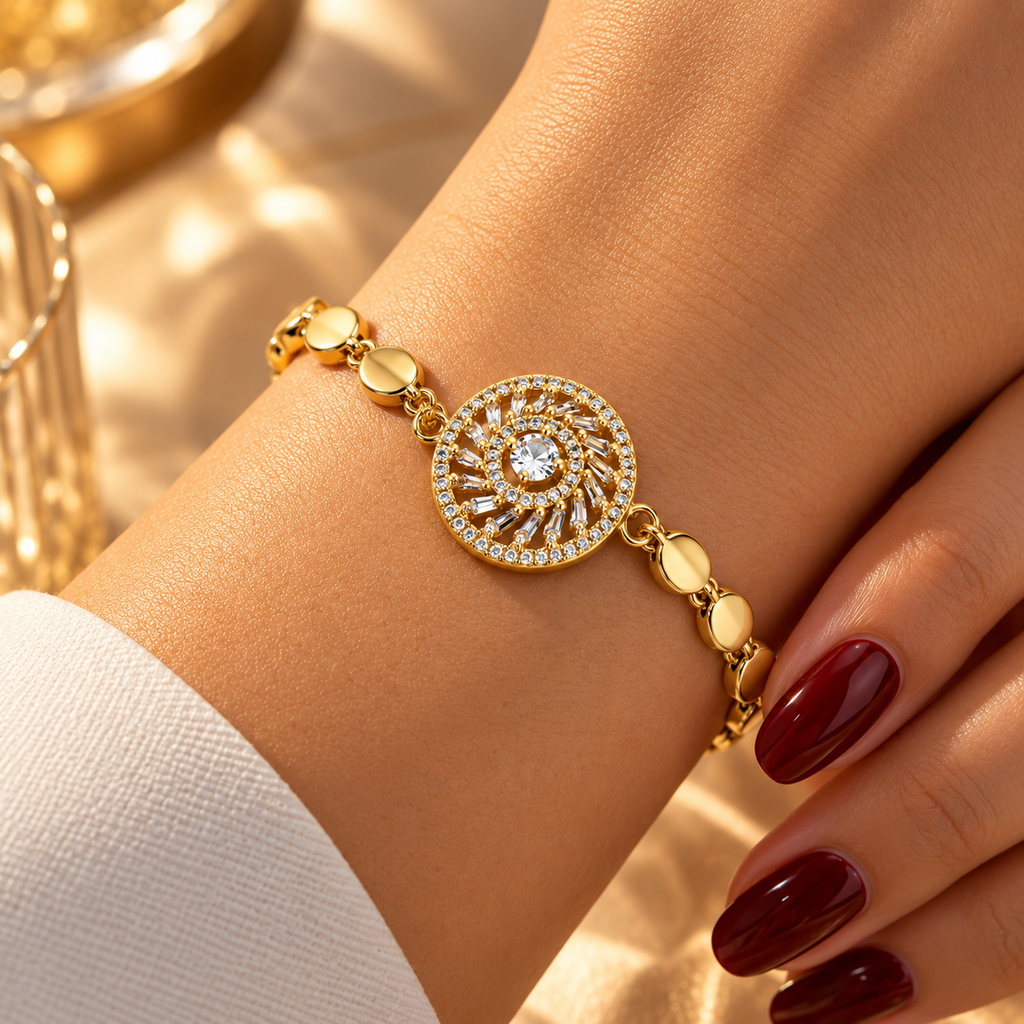 Gold stainless steel bracelet featuring a studded circular charm and a sun-eye motif.