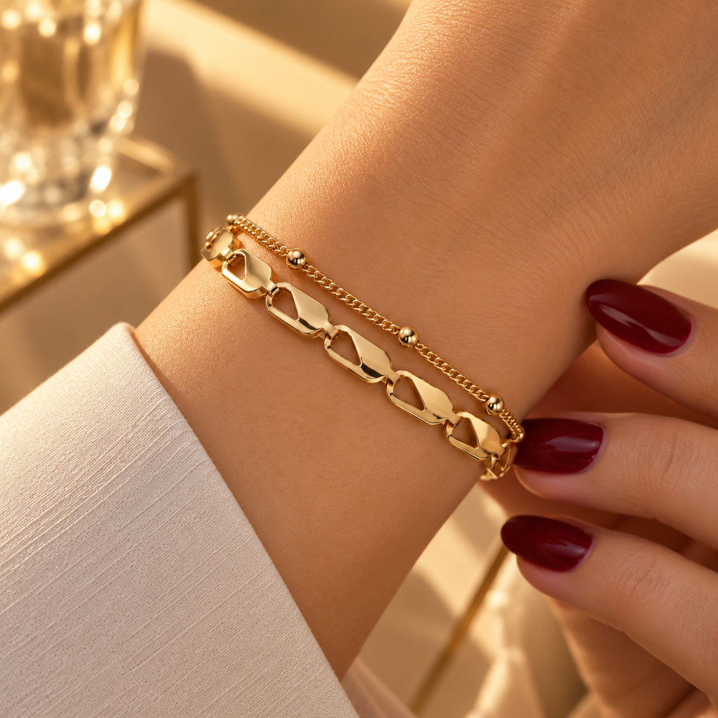 Double-strand stainless steel bracelet featuring geometric links and gold beads.