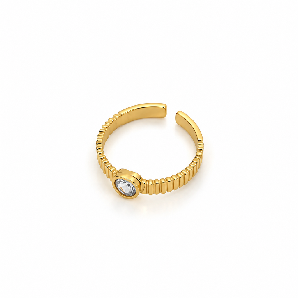 Open stainless steel ring with a heart stone and ribbed texture.
