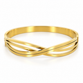 Stainless steel bracelet with interlocking gold-tone lines.