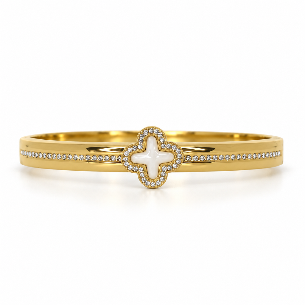 Stainless steel bracelet with an embellished mother-of-pearl flower.