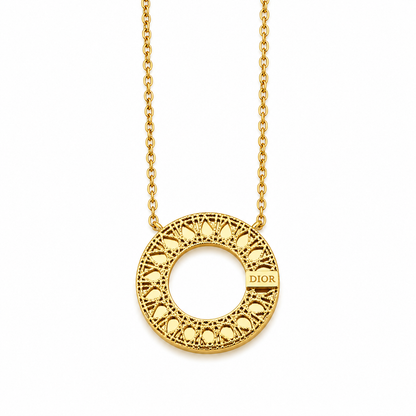 Gold-plated stainless steel necklace with a circular pendant featuring geometric patterns.