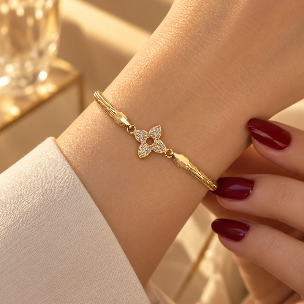 Stainless steel snake chain bracelet with an embellished flower