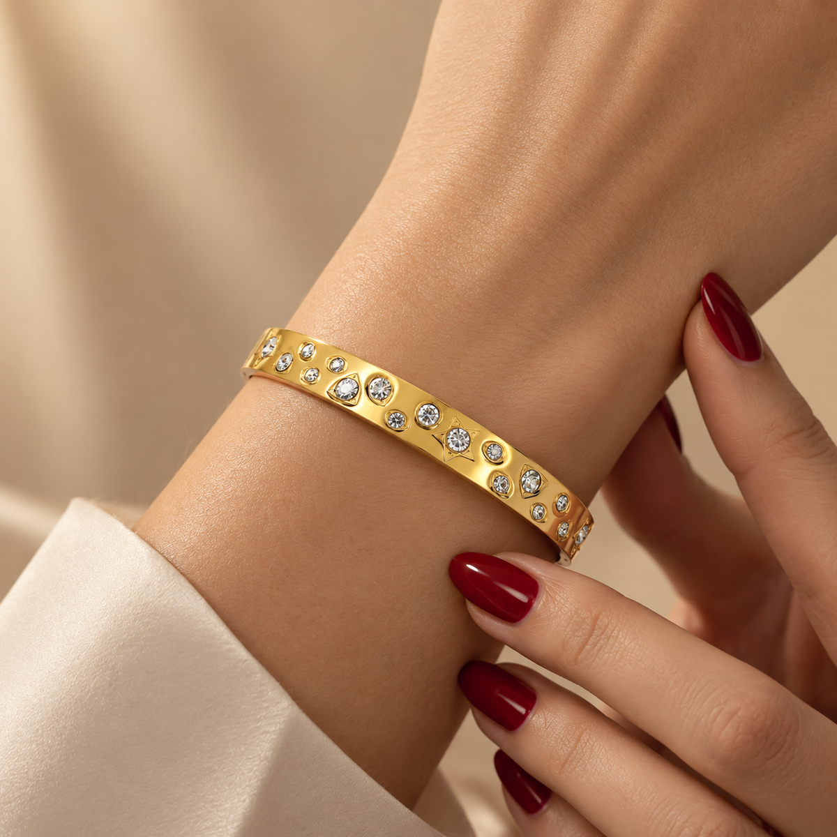 Stainless steel bracelet featuring geometric shapes and studded stars.