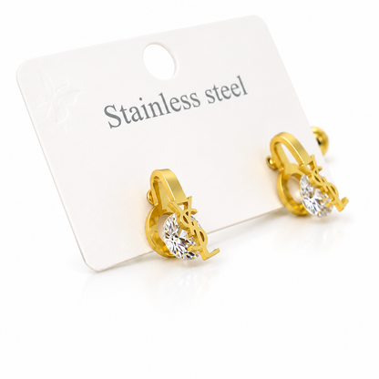 Gold-plated stainless steel earrings with an interlocking letter design and crystal stone