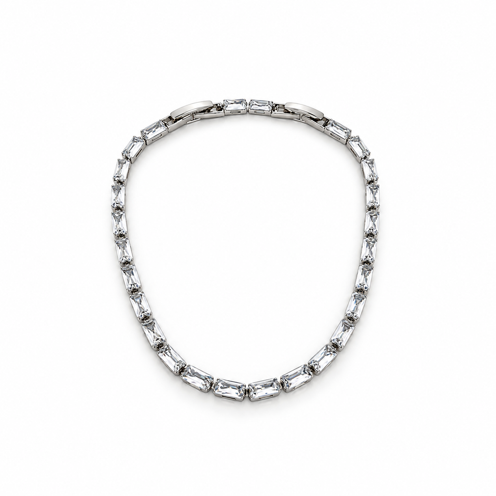 Silver stainless steel tennis bracelet featuring rectangular zirconia stones.