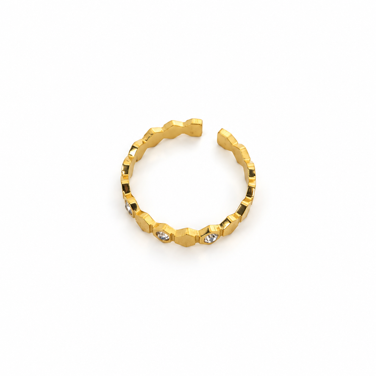 Open stainless steel ring with a honeycomb design and zirconia.