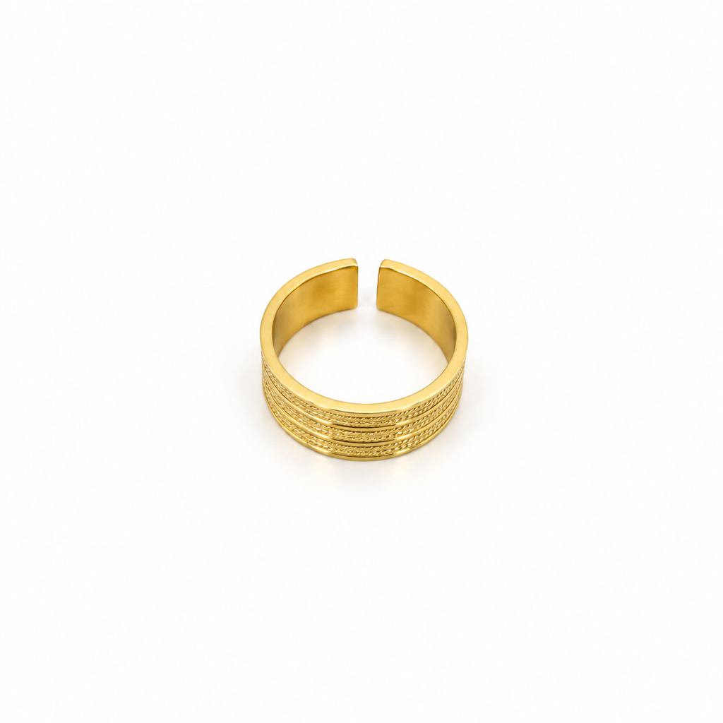 Open stainless steel ring with a wide surface and braided lines.