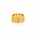 Open stainless steel ring with a wide surface and textured lines.