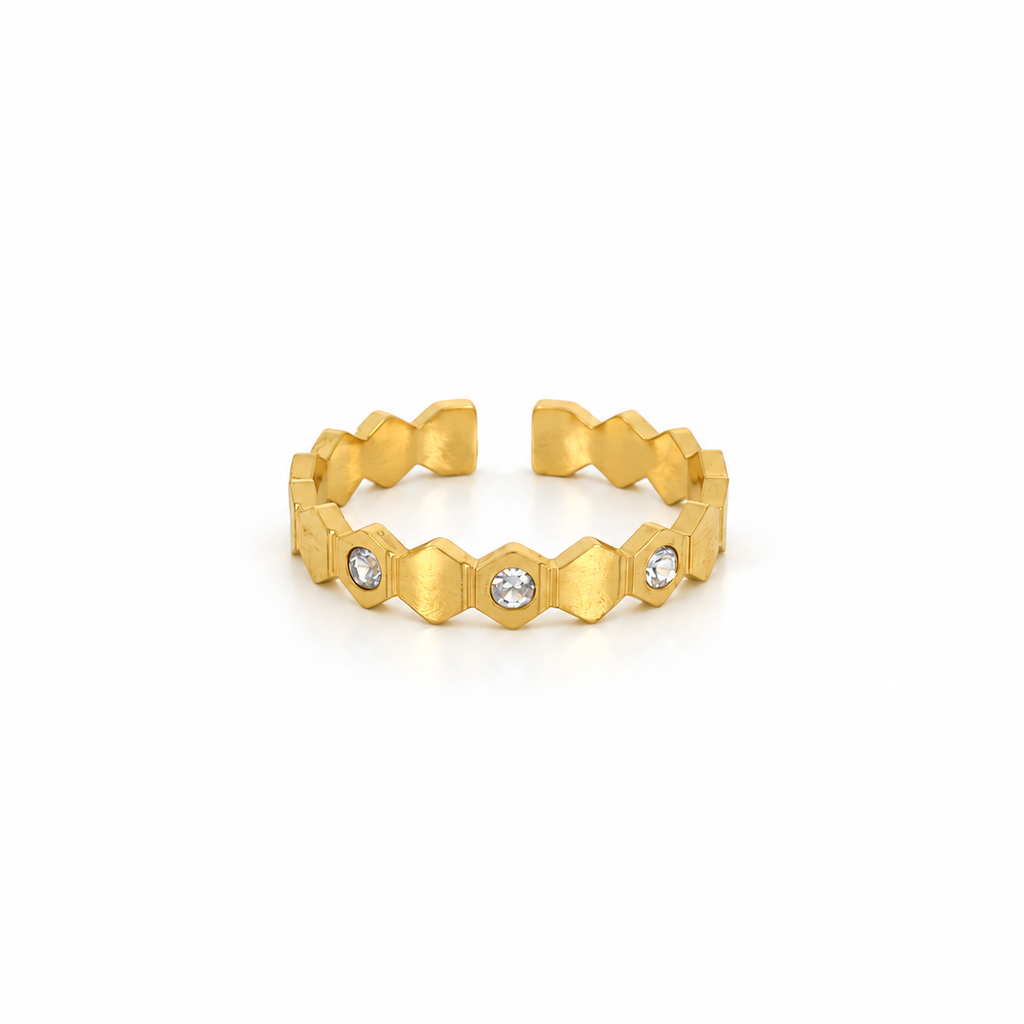 Open stainless steel ring with a honeycomb design and zirconia.