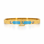 Stainless steel bracelet with gold letters and a sky-blue enamel strip.