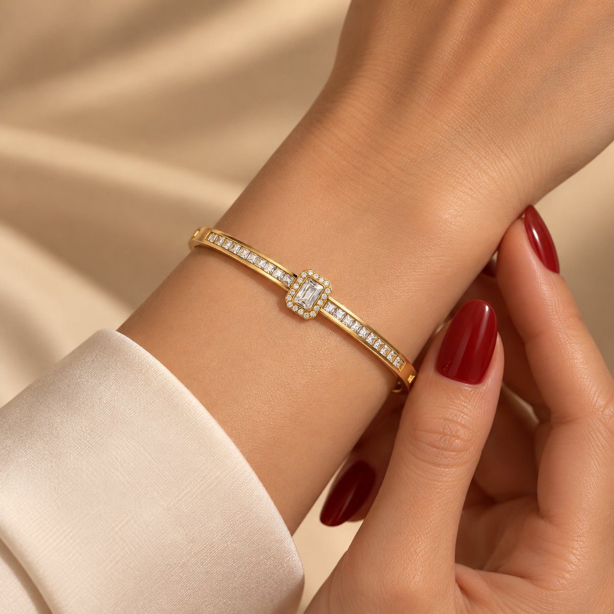 Stainless steel bracelet with a crystal emerald stone and a studded band.
