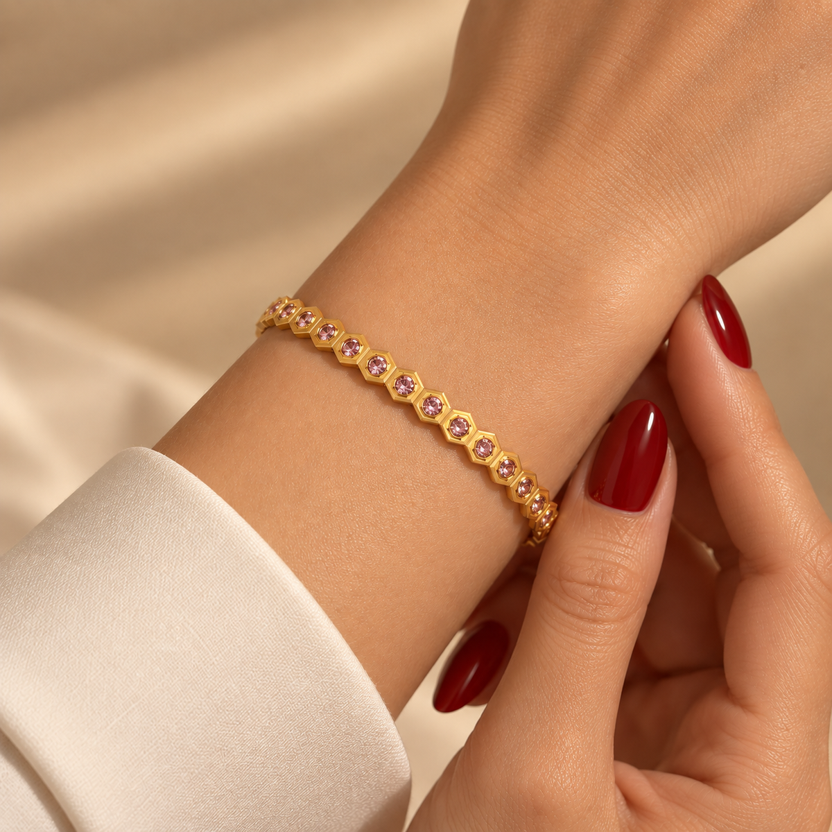 Stainless steel bracelet with a honeycomb pattern and pink zircon.