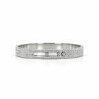 Silver stainless steel bracelet featuring moving, studded stones.