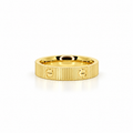 Faceted stainless steel ring with gold screw-head detailing.