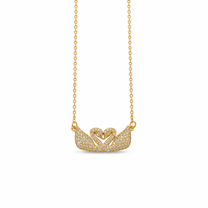 Gold-plated stainless steel necklace with a two-swan design, studded with crystals.