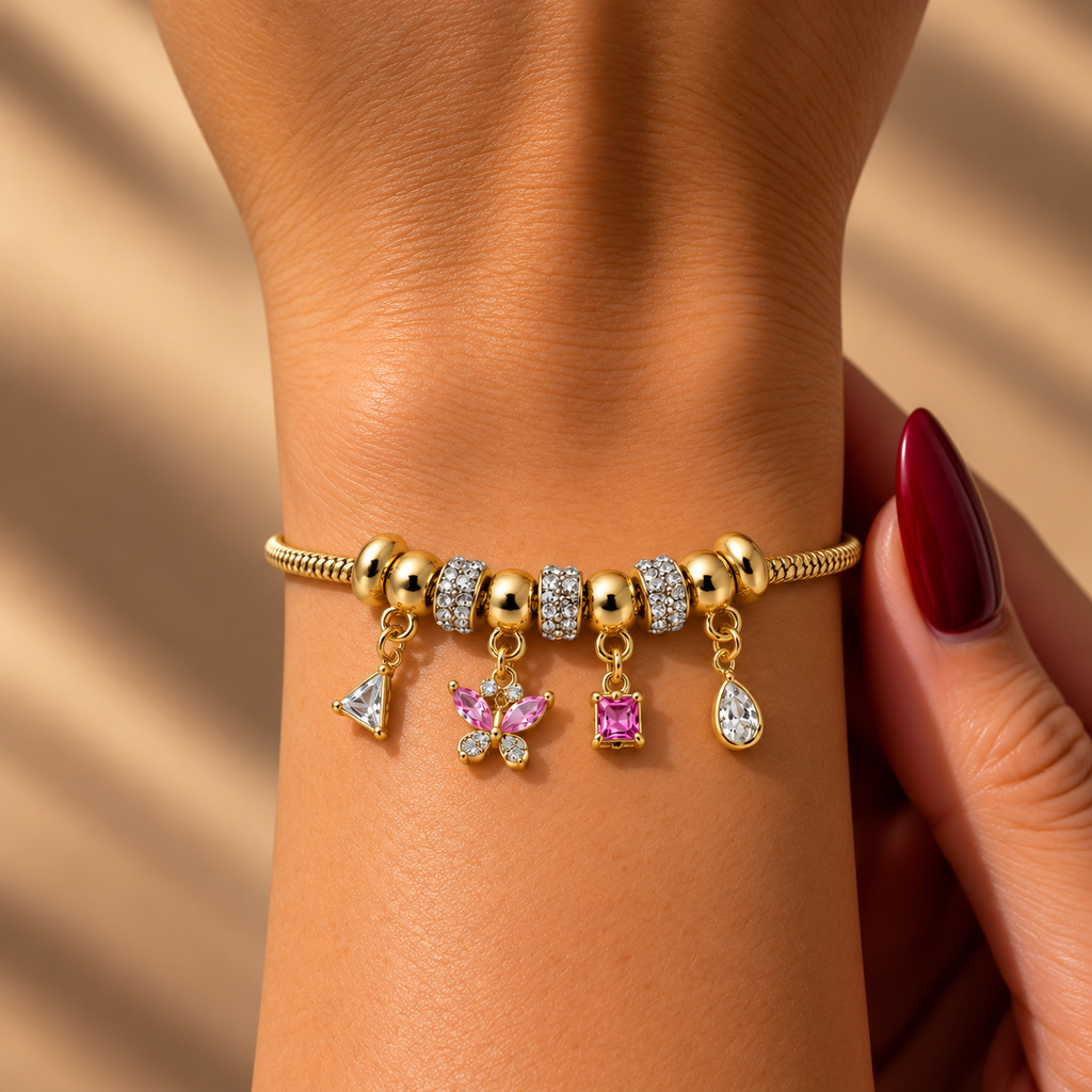 Stainless steel bracelet featuring snake-style beads, butterfly charms, and pink crystals.