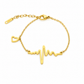 Gold-plated stainless steel bracelet with a heartbeat and heart pendant design