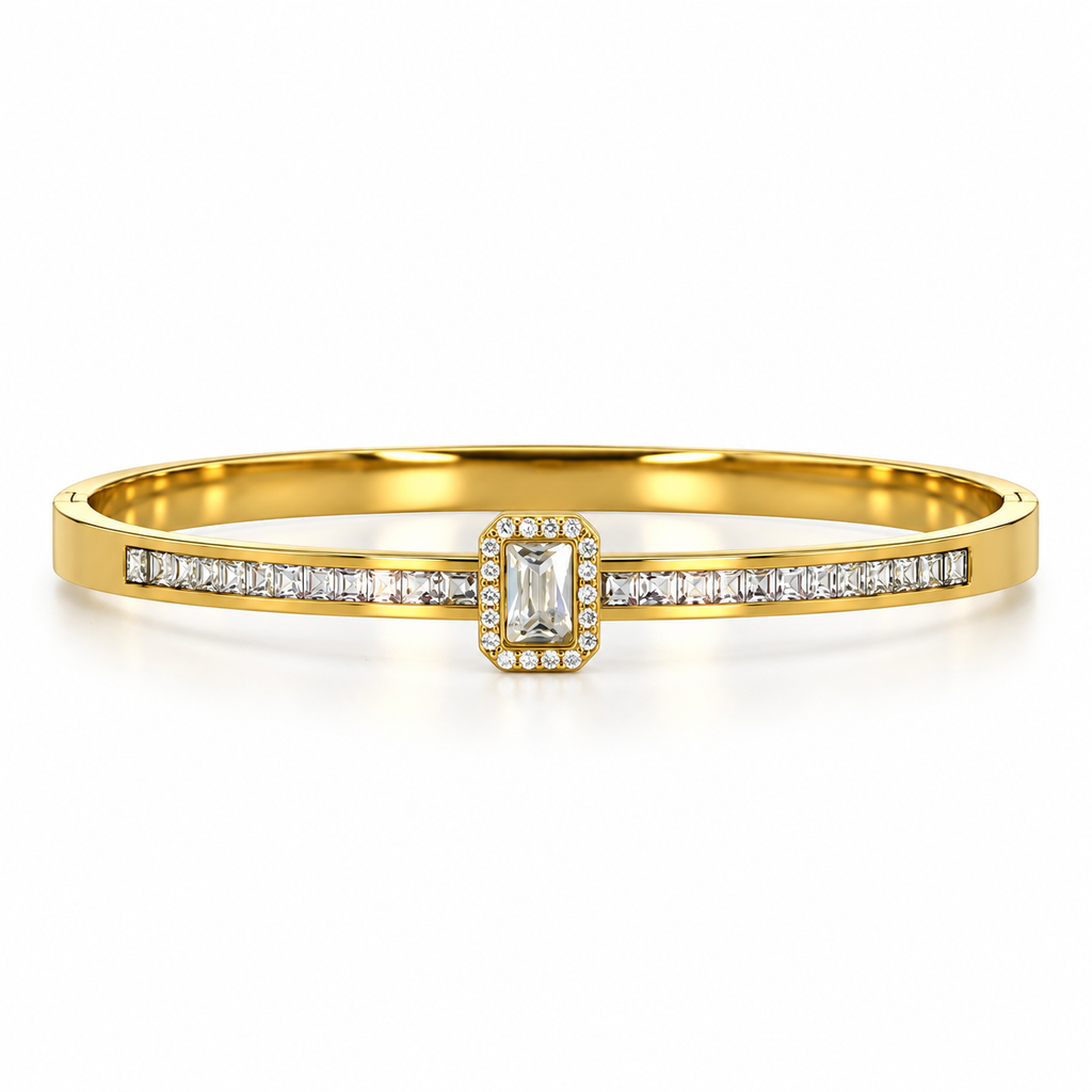 Stainless steel bracelet with a crystal emerald stone and a studded band.