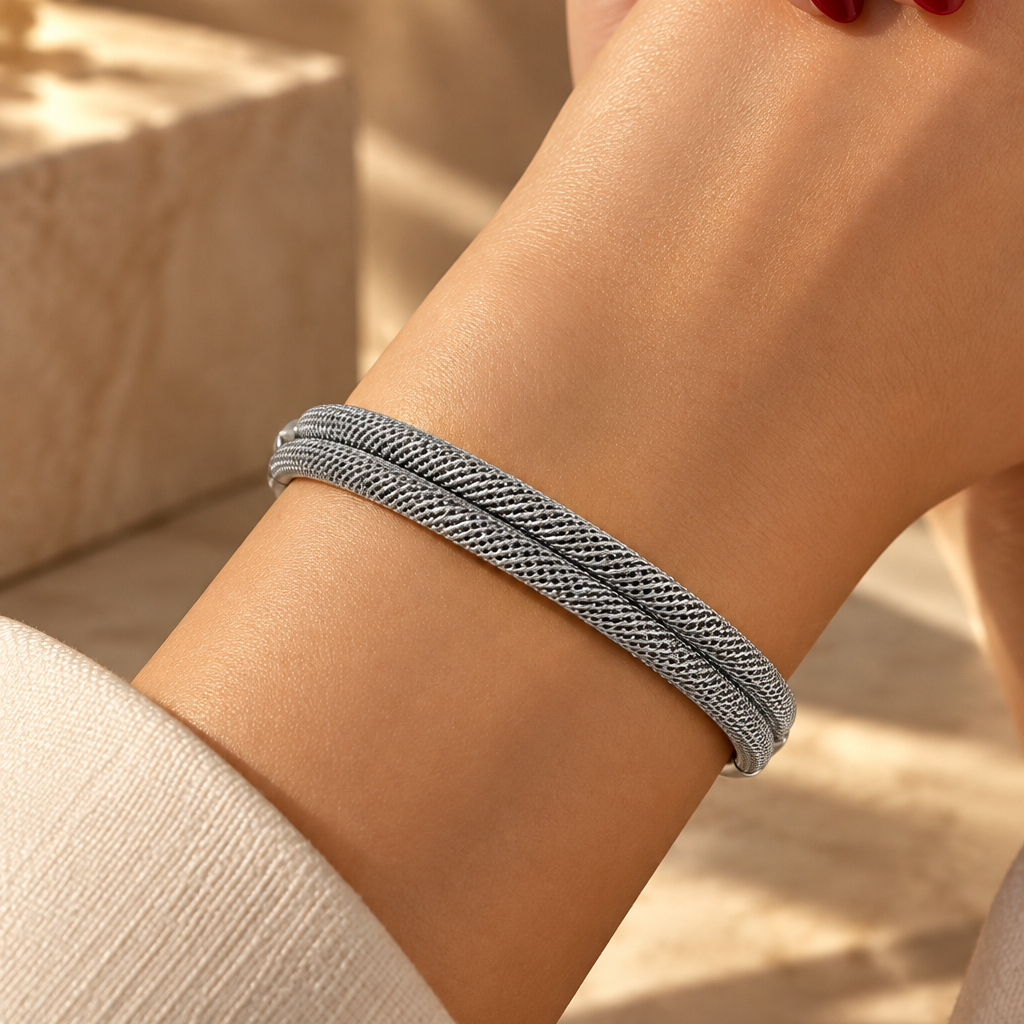Silver stainless steel bracelet with a double-mesh design.