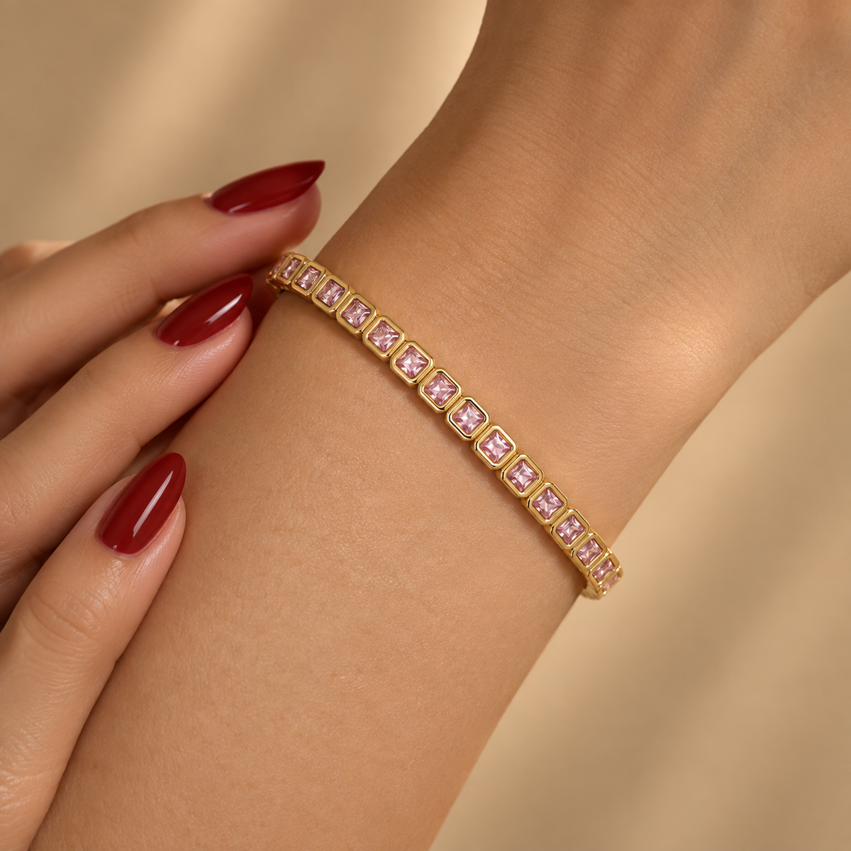 Stainless steel bracelet with square links and pink zircon.